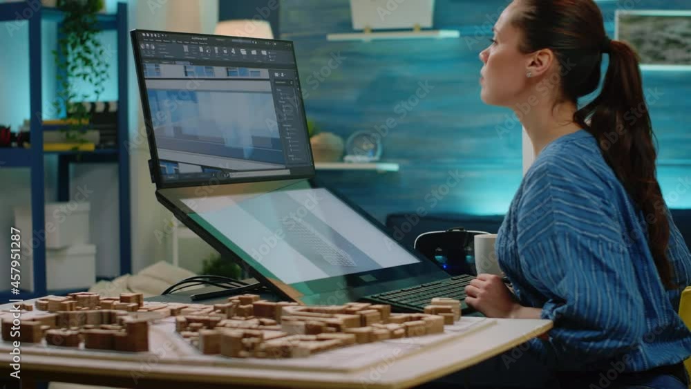 Poster woman working as architect looking at maquette on computer for construction layout and design. engin
