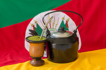 Kettle, mate and state flag of Rio Grande do Sul - Brazil in the background. Decoration in...