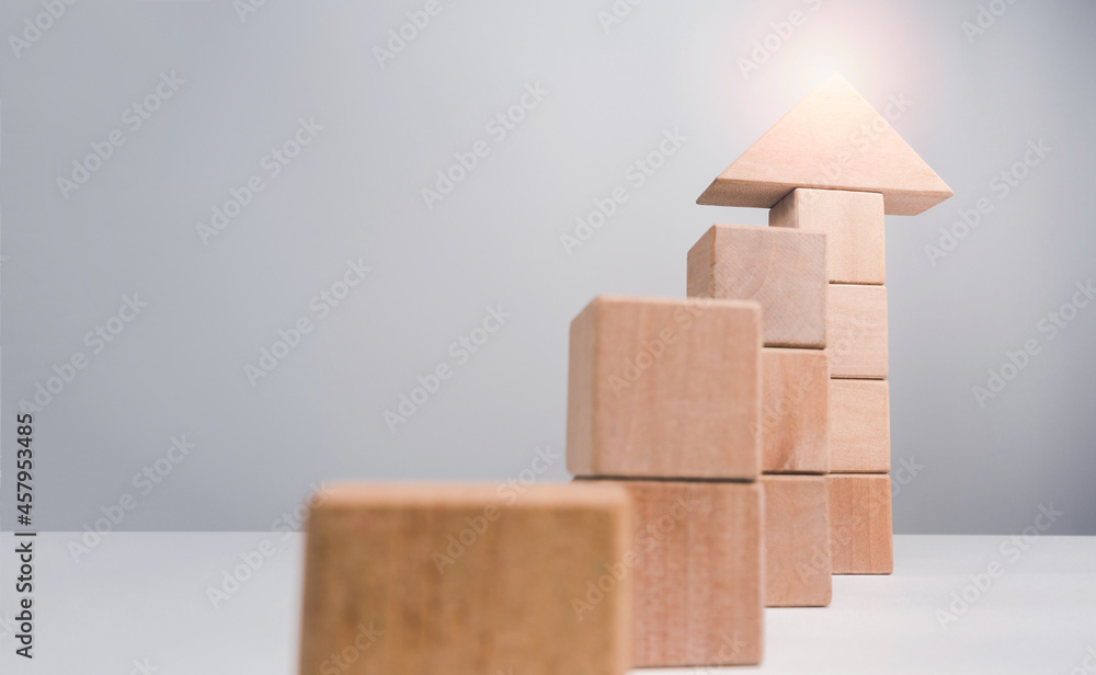 Poster business growth success concept. wooden blocks stacking as an arrow up averages as a growth graph ch