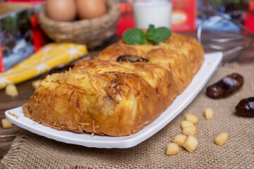 Pineapple bread, the typical food of the city of Tegal, Indonesia, decorated with dates and cheeses