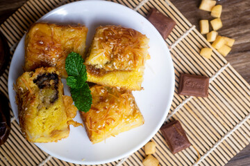 Pineapple bread, the typical food of the city of Tegal, Indonesia, decorated with chocolates, cheeses, and dates 