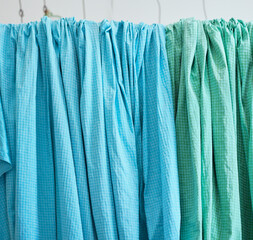 Blankets, pillowcases, sheets are drying out. Hang on the rack, hang the cloth. indoors