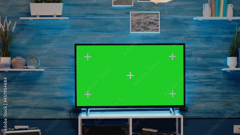 Poster nobody in flat with green screen tv display used to design chroma key with isolated media. empty roo