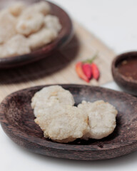 Cireng or fried aci. Cireng is made from starch or tapioca flour dough and is usually added with other ingredients such as chicken or sausage and then fried. Cireng has a chewy texture. Focus blur.