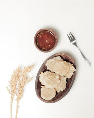 Cireng or fried aci. Cireng is made from starch or tapioca flour dough and is usually added with other ingredients such as chicken or sausage and then fried. Cireng has a chewy texture. Focus blur.