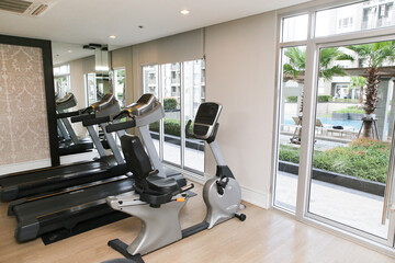Fototapeta na wymiar Modern gym interior with equipment. fitness center interior