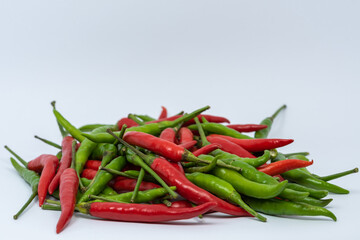 Red and green hot chili peppers isolated on white background. 