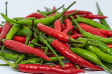 Red and green hot chili peppers isolated on white background. 