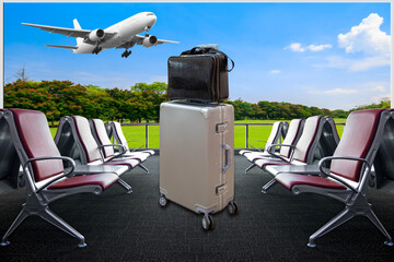 Luggage and Empty chairs in the hall of airport terminal during waiting for boarding passengers and...