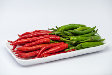 Red and green hot chili peppers isolated on white background. 