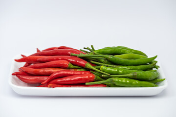 Red and green hot chili peppers isolated on white background. 