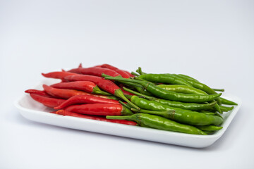Red and green hot chili peppers isolated on white background. 