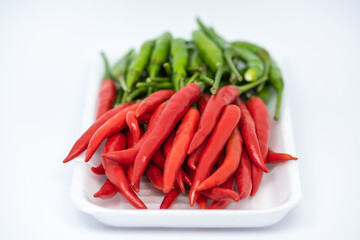 Red and green hot chili peppers isolated on white background. 