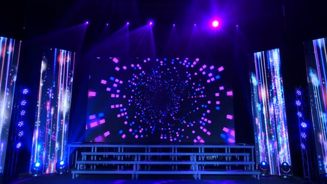 Animation of stage lights frame. Bright shiny stage lights flashing movement entertainment spotlight projectors in the dark, blue soft light spotlight strike on black background.