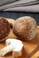 Shiitake mushroom details on cutting board.