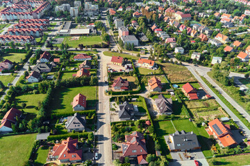 Modern residential district in Europe town, aerial view. Residential neigborhood, bird eye view. City streets with luxury house buildings and parked car