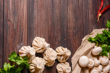 Georgian dumpling or Khinkali. Georgian homemade khinkali on wooden background.