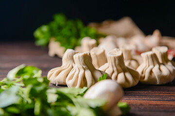 Georgian dumpling or Khinkali. Georgian homemade khinkali on wooden background.