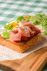 Smorrebrod, traditional Danish open sanwiches, dark rye bread with different toppings.