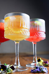 The concept of Georgian cuisine. Cool drinks with ice made of different fruit juice in a glass goblet.