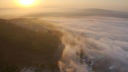 Mount Tavor in the fog at sunrise, Aerial view
Drone view from North Israel at sunrise with Clouds covering the mountain,2021
