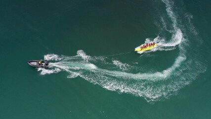 Naklejka premium banana boat in Malaga mediterranean sea, aerial viewDrone view from mediterranean sea spain, 2021 
