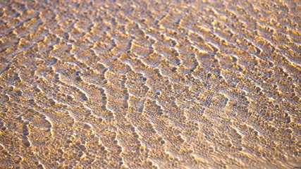 The play of light in shallow water .