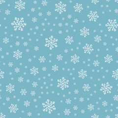 Seamless pattern of snowflakes on a blue background