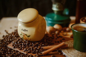 a can of coffee standing on coffee beans