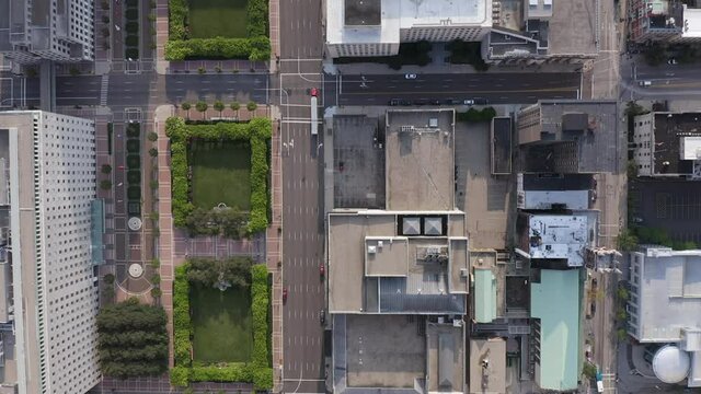 Aerial Overhead View Of Cincinnati Downtown Streets With Urban Grid And Building Rooftops. Truck With Trailer On Empty City Streets