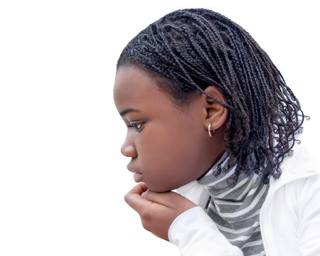Young Afro beauty (ten years old) , pensive expression, side view, white background