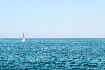 Fototapeta premium tourist boat sailing here on the blue sea.