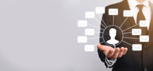 Male hand holding letter icon,email icons .Contact us by newsletter email and protect your personal information from spam mail. Customer service call center contact us.Email marketing and newsletter