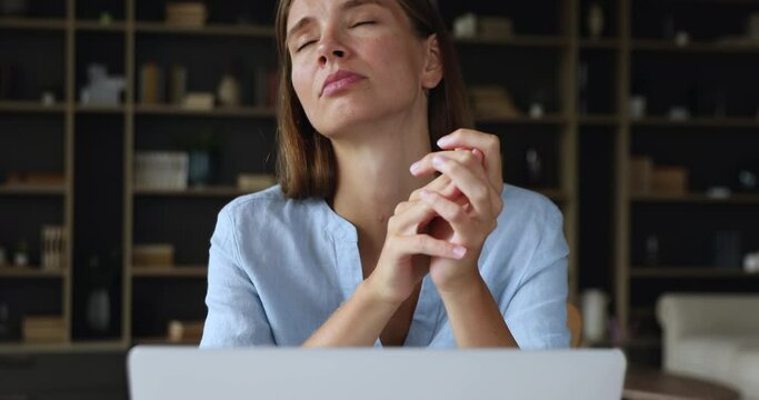 Concerned worried young woman freelance worker look at laptop screen feel shame nervous missing deadline. Anxious upset female student teenager refuse to believe she failed exam college admission test