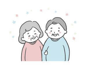 腕を組み笑顔で会話する老夫婦