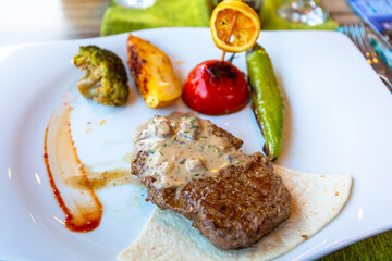 Beef steak with grilled vegetables on the plate