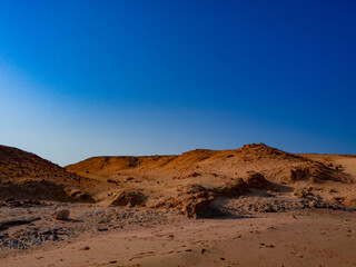 Fototapeta na wymiar Beautiful Egyptian desert. Blue sky and sand. Marsa Alam