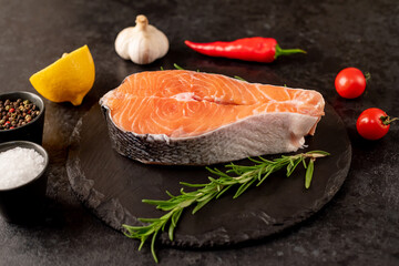 raw salmon steak on stone background