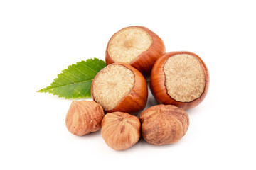 Ripe filbert and green leaves isolated on white