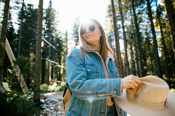 A girl in a hat at the autumn forest