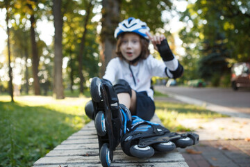 Close up of rollerskates young boy is wearing, relaxing after skating