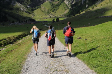 three friends hiking in switzerland 
