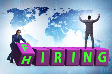 Fototapeta premium Hiring and firing concept with turning cubes