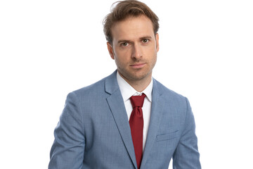 sexy young businessman in blue suit being confident and posing