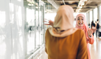 Two young friend beauty islamic asian arabic muslim woman wearing a hijab enjoying and having fun...