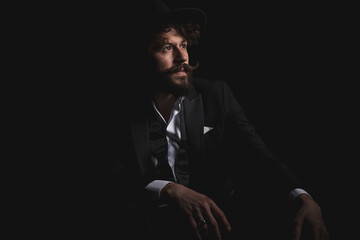 Fototapeta premium businessman relaxing his hands on his lap and looking away