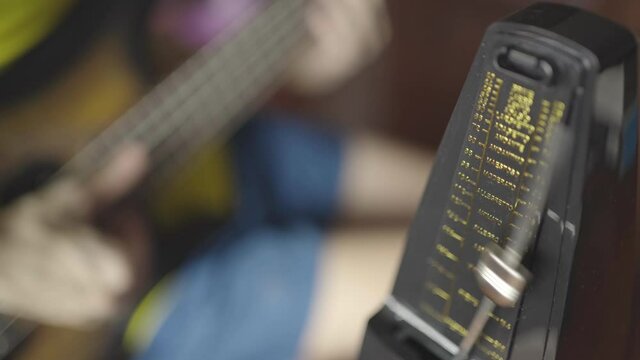 Practicing electric bass with metronome
