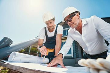 Construction workers are checking building layout outdoor