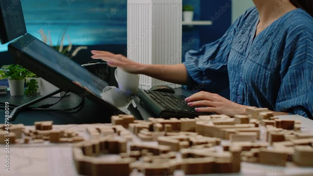 Aufkleber close up of hands using touch screen monitor with building model and maquette on table. architect wo