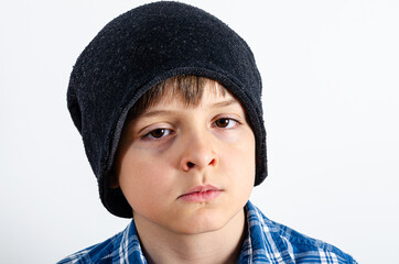Serious kid in the grey hat